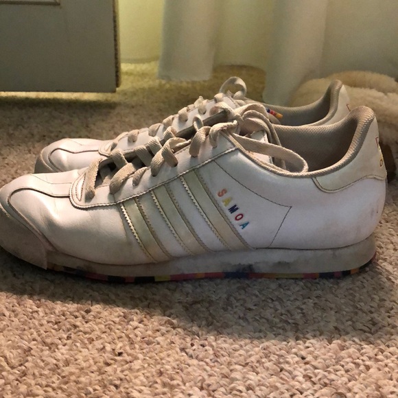 white adidas shoes with colorful bottoms